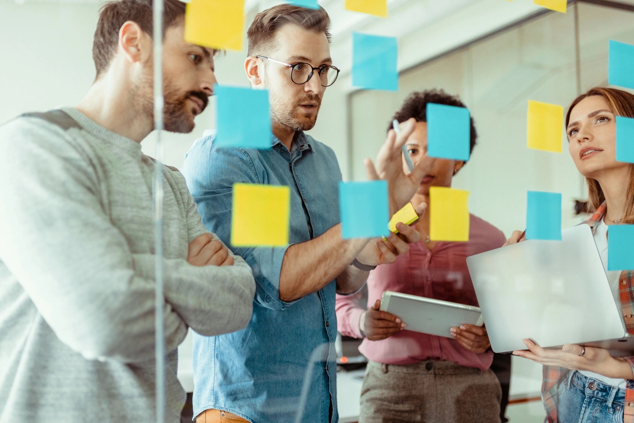 Marketing team collaborating with sticky notes during a strategy session